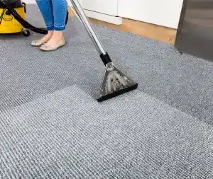 vacuuming a carpet